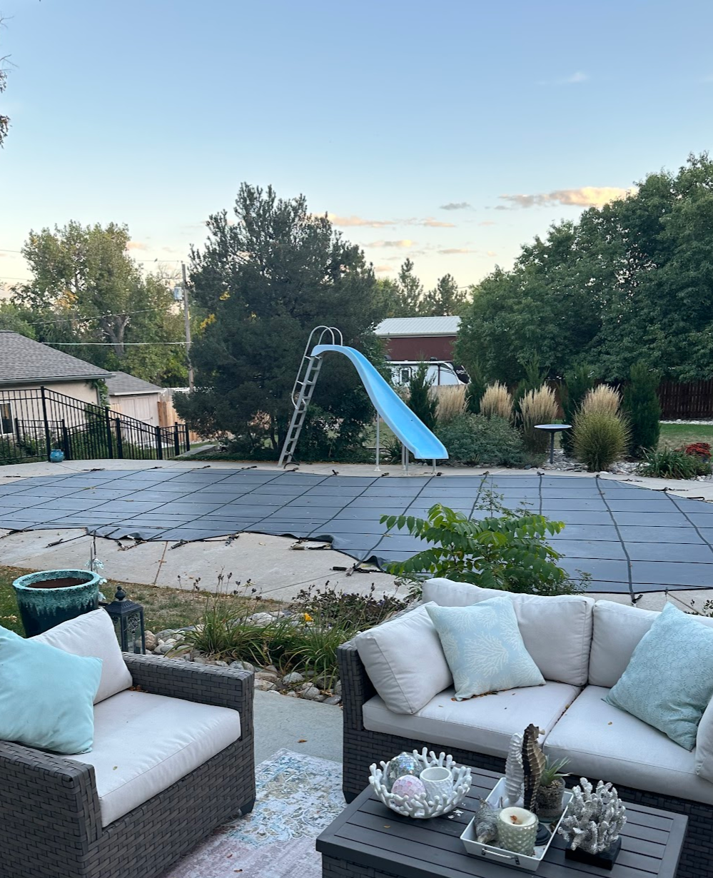 Well-maintained pool area with professional safety cover installation